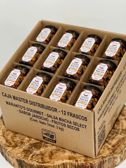 Cardboard box containing 12 jars of Marantos Gourmet salsa in a 3x4 grid arrangement on a wooden surface